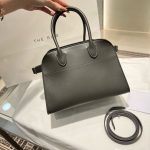 The Row Margaux 10 slouchy soft shopper handbag in box leather with protective feet