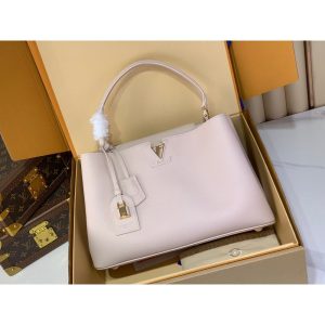 Louis Vuitton LV Capucines MM Top Handle handbag in orange calfskin