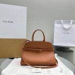 The Row margaux 12 belt shoulder tote holiday carryall handbag luggage resort beach tote