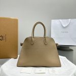 The Row margaux 15 shell belt shopper tote convertible travel carryall handbag in grainy calfskin