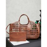 Large Women's laser-cut cage shopper handabg Miu miu resort beach tote with detachable clutch