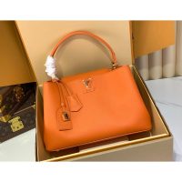 Louis Vuitton LV Capucines MM Top Handle handbag in orange calfskin