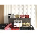 Chanel East-West Top Handle Baguette/mini handbag in metallic patent leather