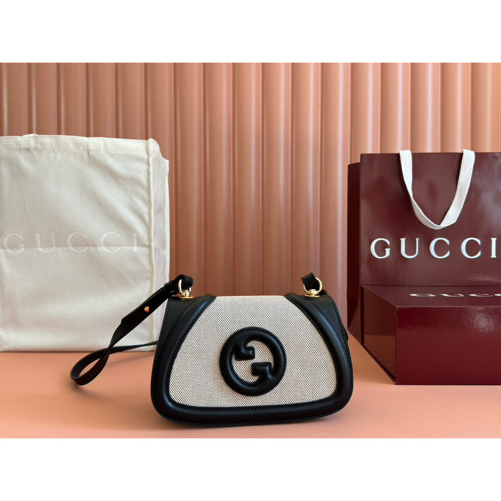 ph-11134201-820lg-mqsrna0nlc77cf.jpg Gucci small Saddle Bag in GG Canvas and Calfskin