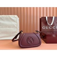 Gucci small burgundy Saddle Bag in GG Canvas and Calfskin